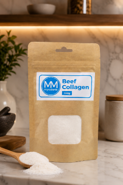 A pouch of MM Ingredients Beef collagen powder on a modern kitchen worktop with a spoon of collagen powder in the foreground