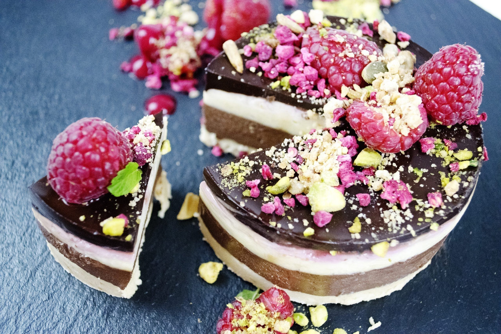 A triple chocolate and raspberry Bavarois dessert set with gelatine, served on a plate